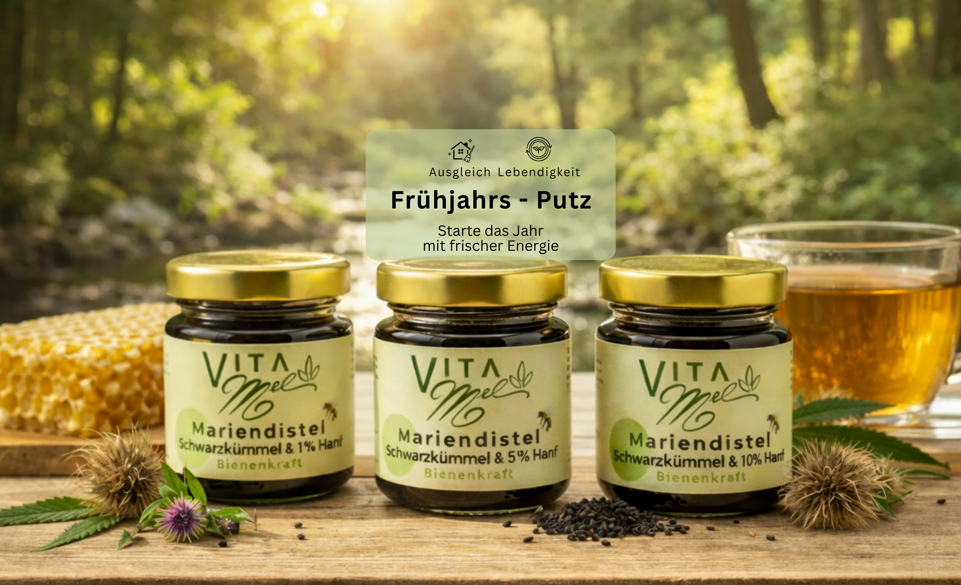 VitaMel Produkte mit Mariendistel, Schwarzkümmel und Hanf neben Tee in natürlicher Waldumgebung